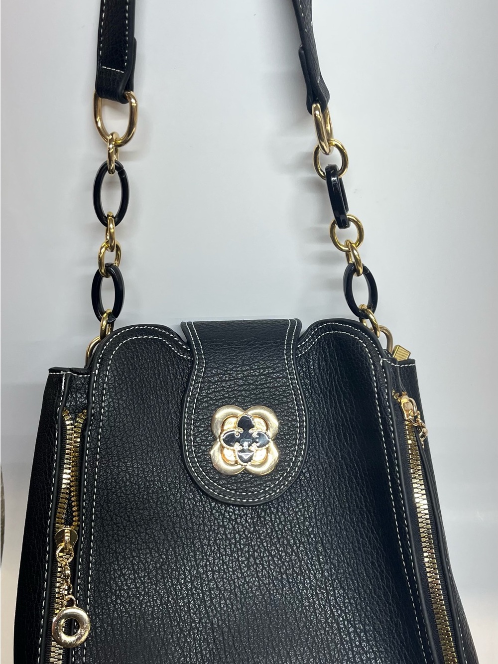 Black Pebbled Shoulder Bag with Gold Floral Accent